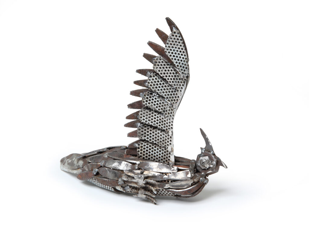 Crested pigeon getting wet under sprinkler - Sculpture - W K